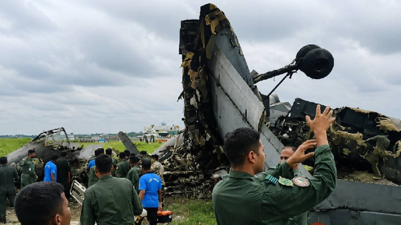 ndian Air Force personnel gather near the wreckage of an An-32 military transport aircraft following a fatal crash in Assam.
