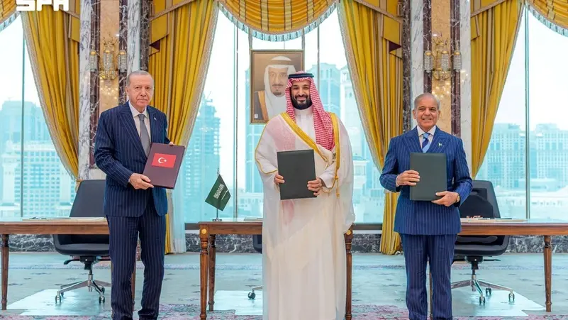 Flags of Saudi Arabia, Pakistan and Turkey representing the Mecca Joint Defense Agreement.